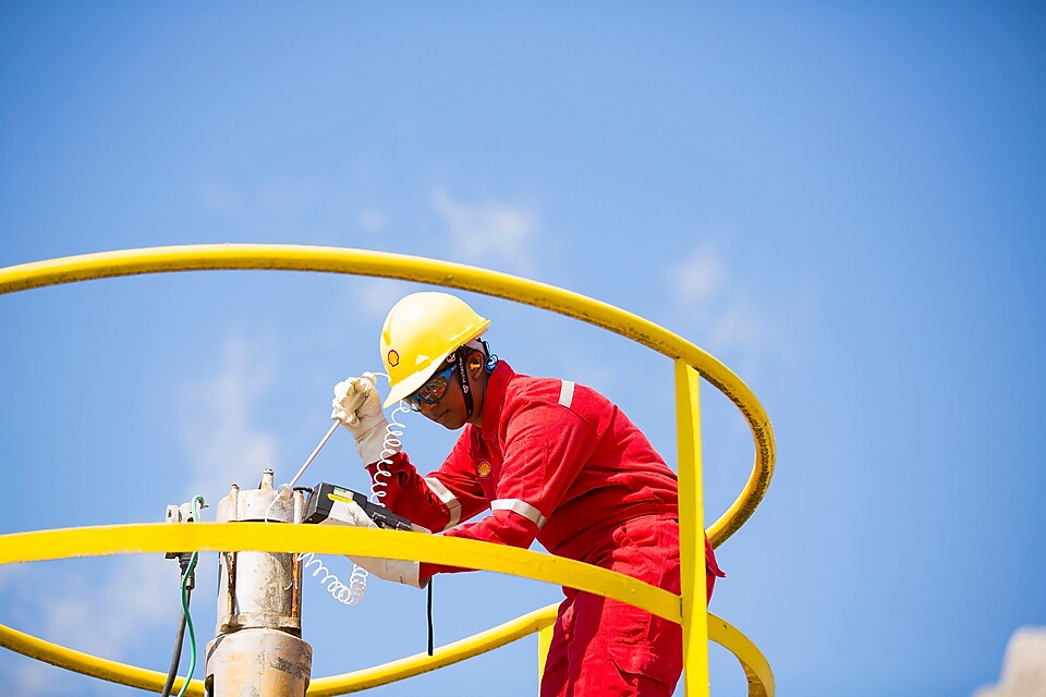 Supervisor checks the well bay while leveraging residue upgrading catalysts.